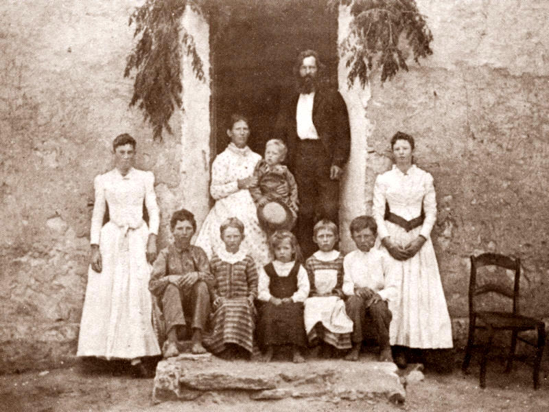 The Fritz Fuchs family in Cypress Mill, 1891: Bettie, Emil, Anna, Olga, Gini, Fritz, Jr., Julia; in doorway, Theodora holding George, Fritz, Sr The Fritz Fuchs family in Cypress Mill, 1891: Bettie, Emil, Anna, Olga, Gini, Fritz, Jr., Julia; in doorway, Theodora holding George, Fritz, Sr